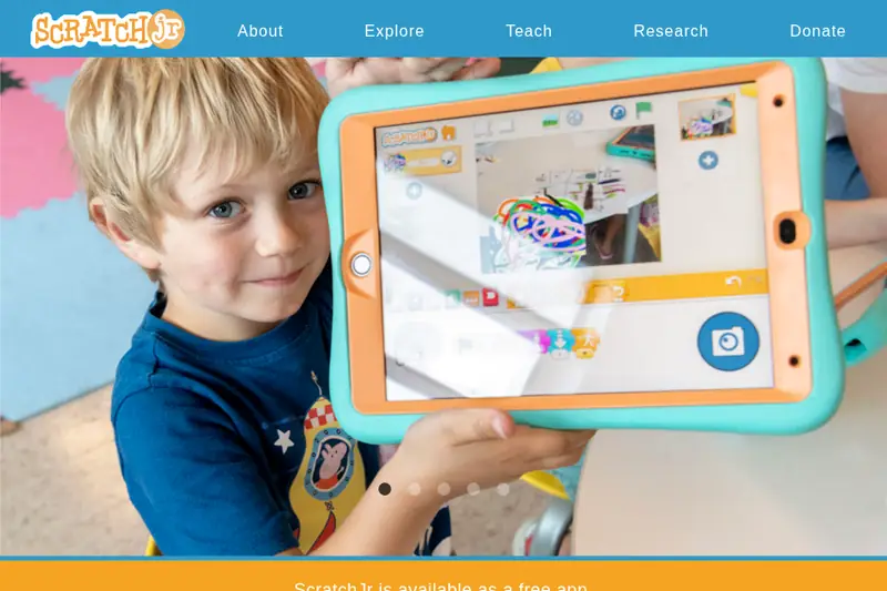 ScratchJr website showing a child using the app on a tablet